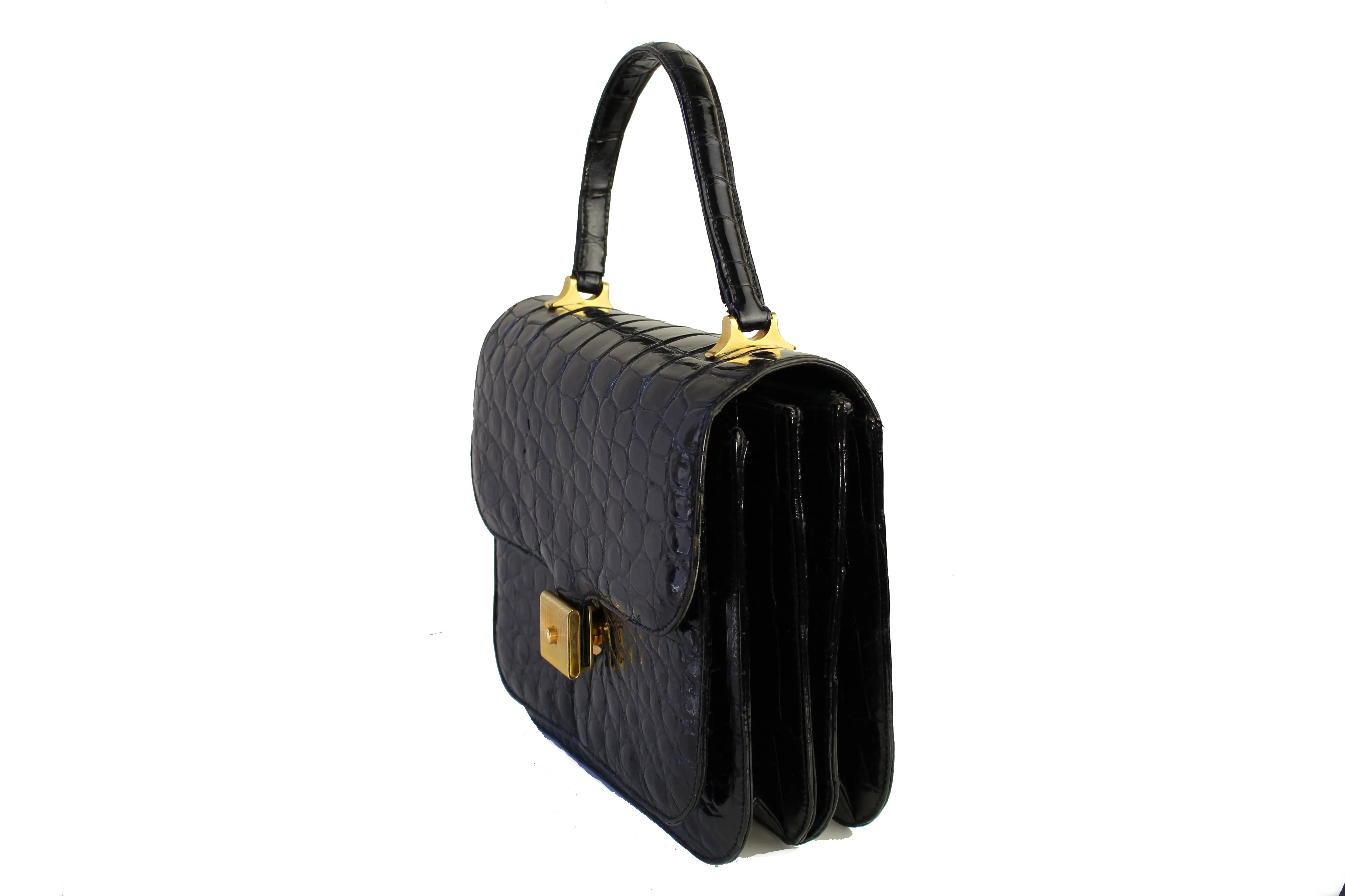 Jet black crocodile skin handbag with flap and decorative clasp