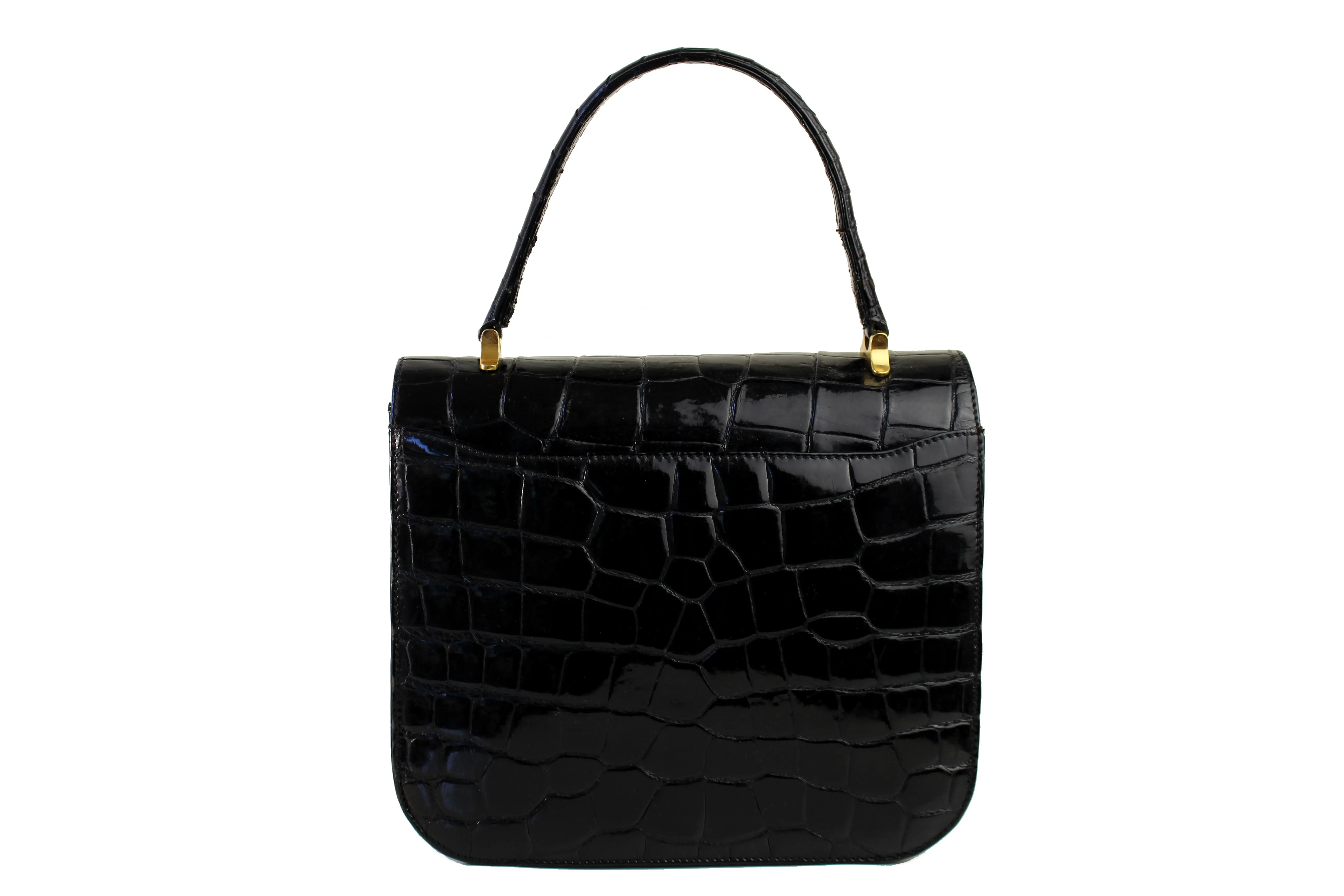 Jet black crocodile skin handbag with flap and decorative clasp