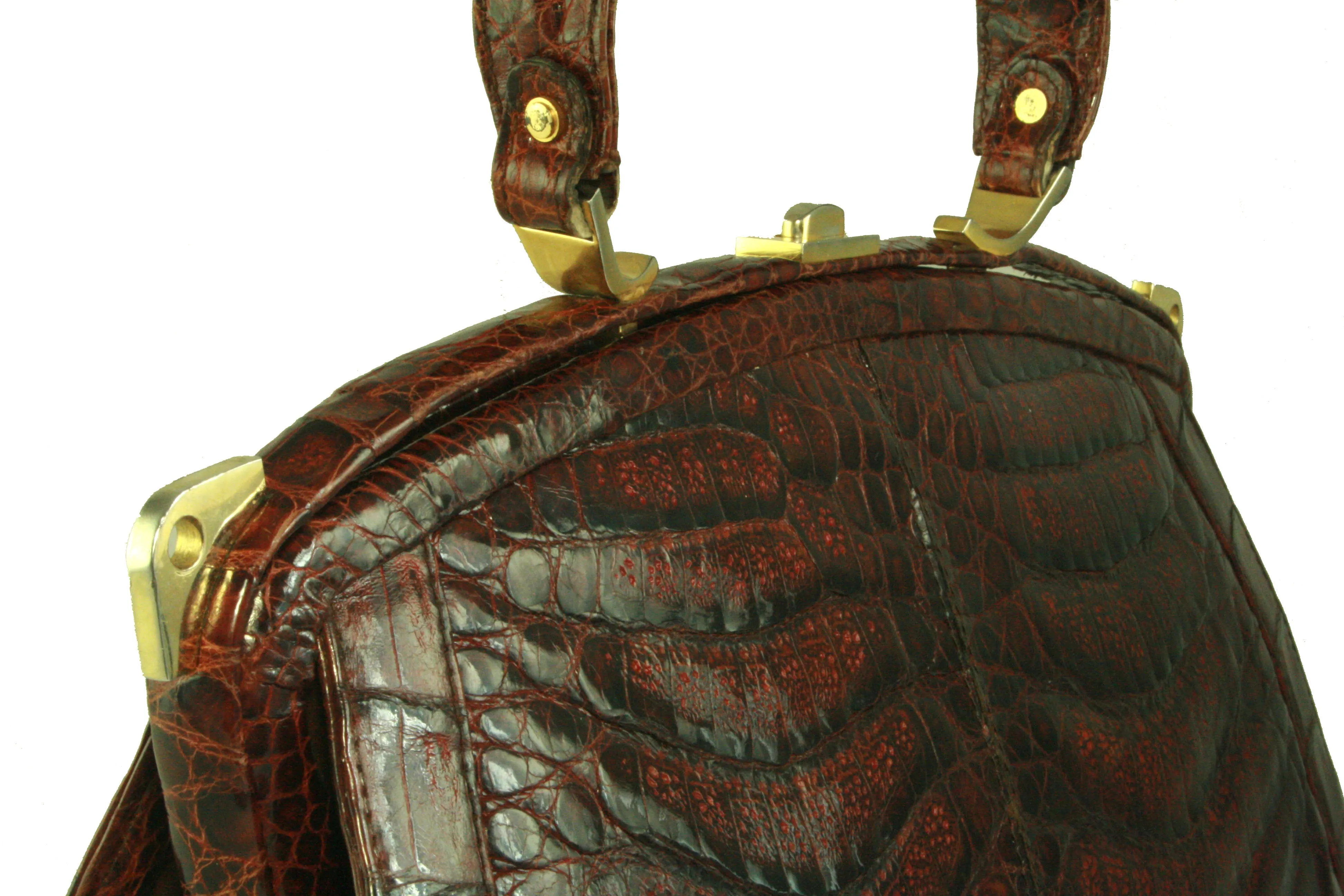 Sizable reddish-brown crocodile skin handbag